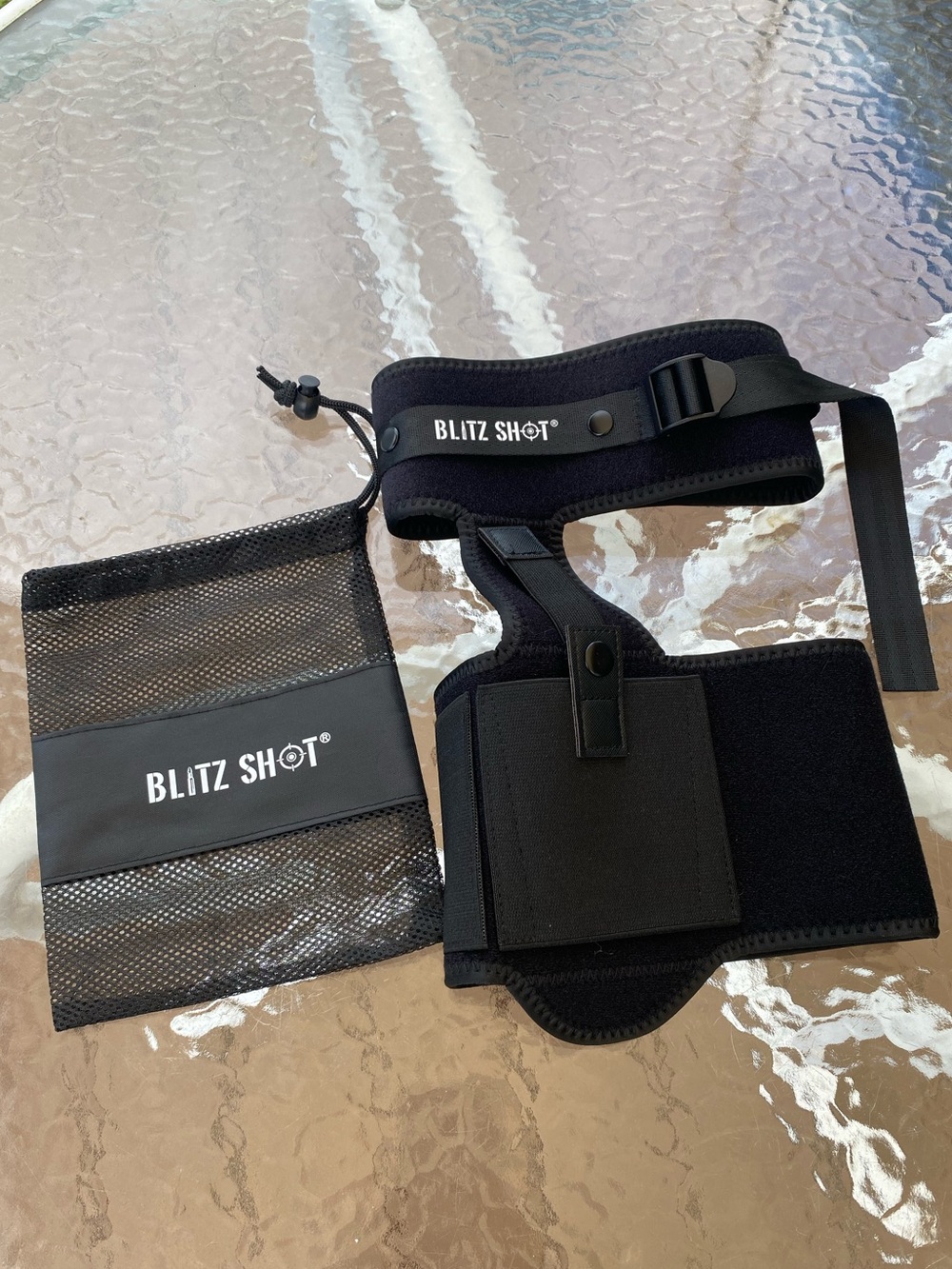 Black concealed carry ankle holster with magazine pocket